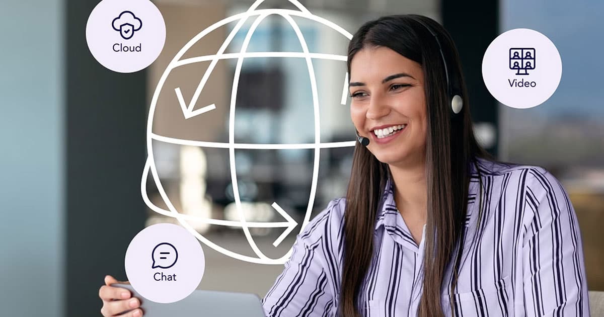 Smiling woman wearing a headset uses a laptop, with digital icons for cloud, video, and chat, and an illustrated globe overlay in the background.